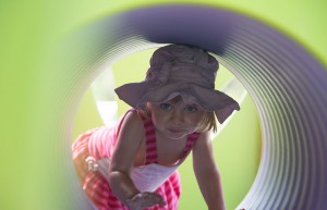 Infant playing in tunnel