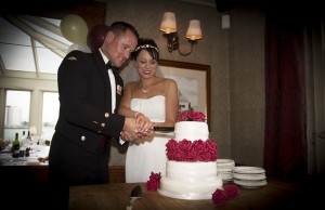 Bride and Groom Cutting Cake